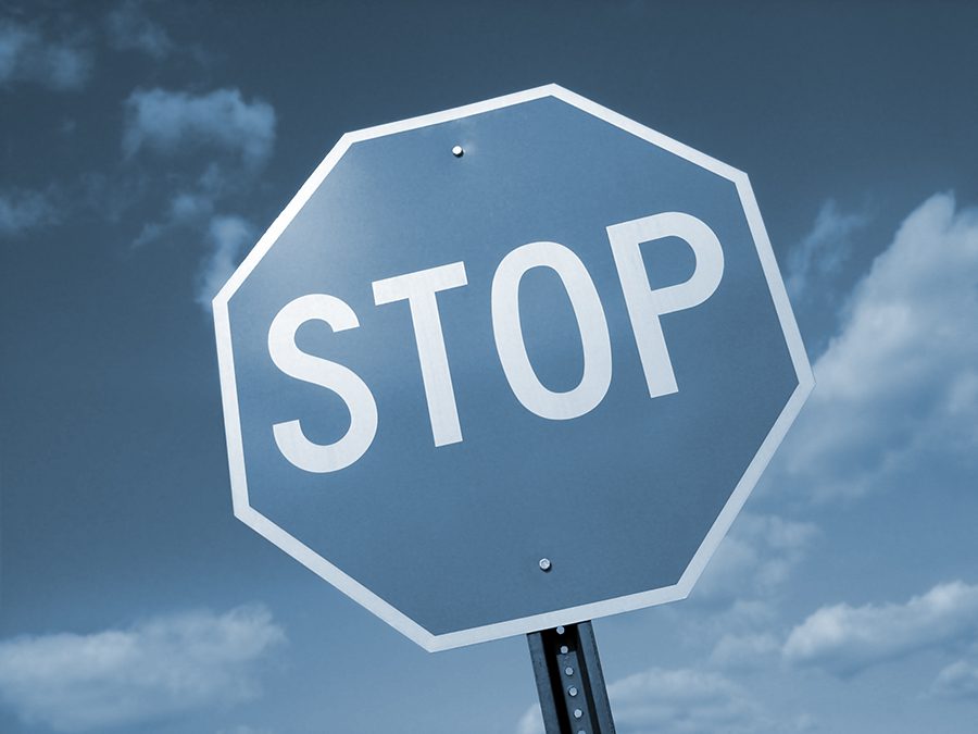 Stop sign on a blue background 