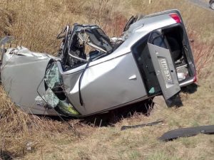 Totaled car in a ditch after a bad accident