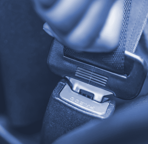 Car passenger fastens seatbelt