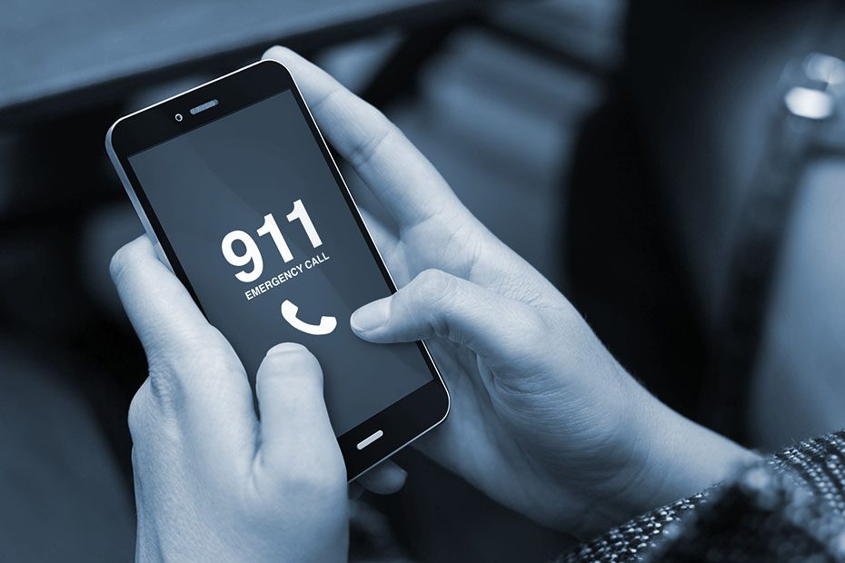 Person call 911 for an emergency on their smart phone