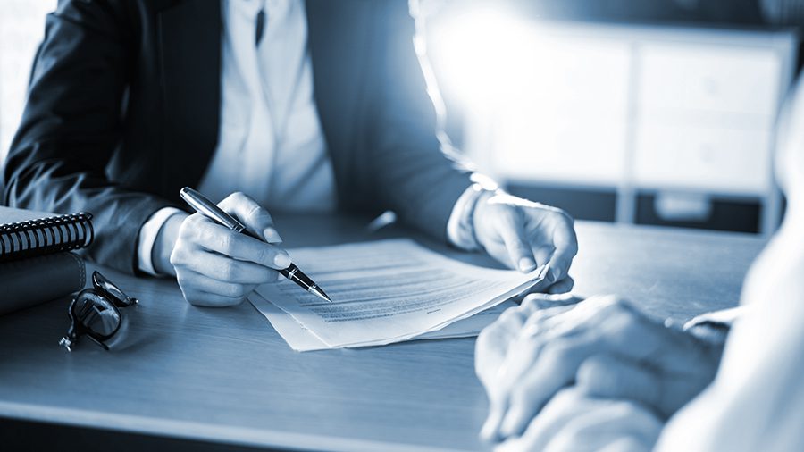 Attorney goes over paperwork with a client