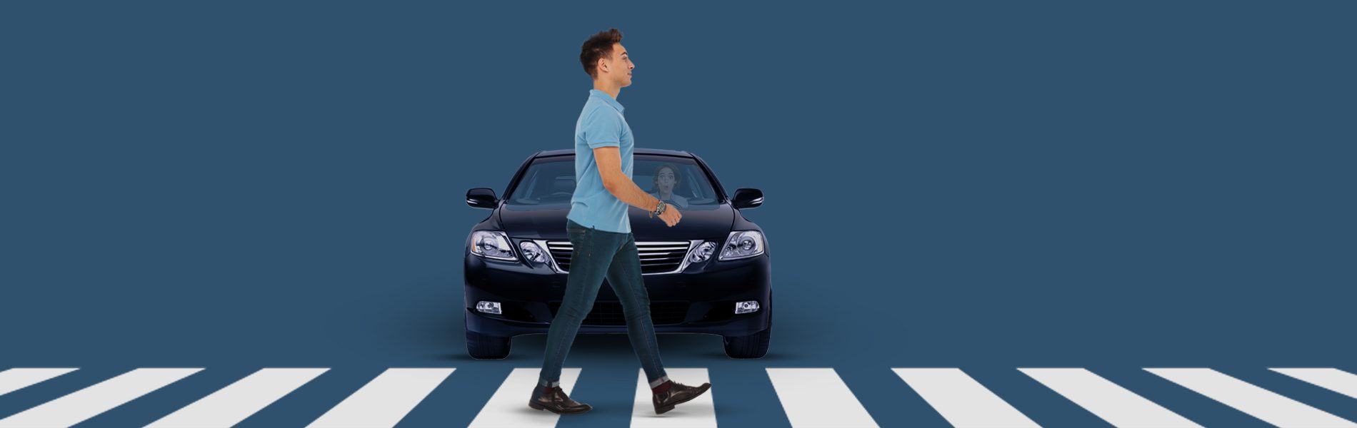 Pedestrian walks in front of car on a crosswalk