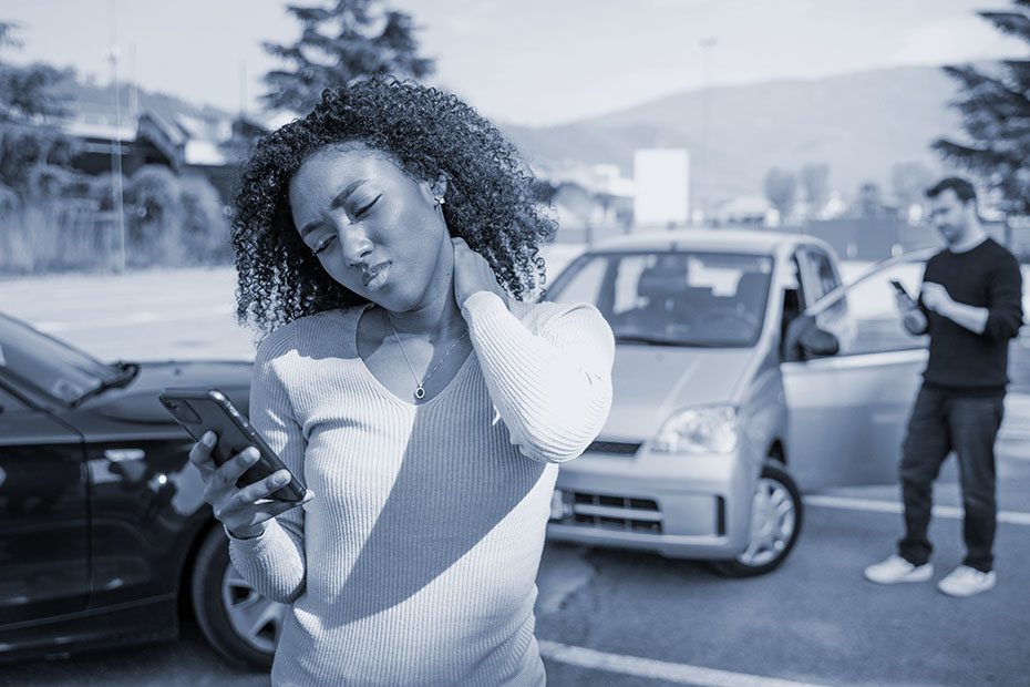 Woman calling insurance company after car crash
