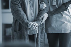 Nurse cares for elderly patient in close up shot