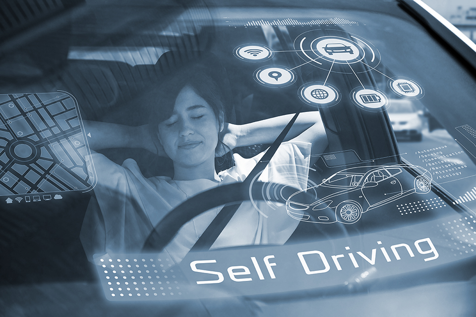woman sleeps in a self-driving car.