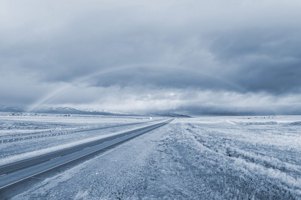 Rainbow over an open road in Montana 