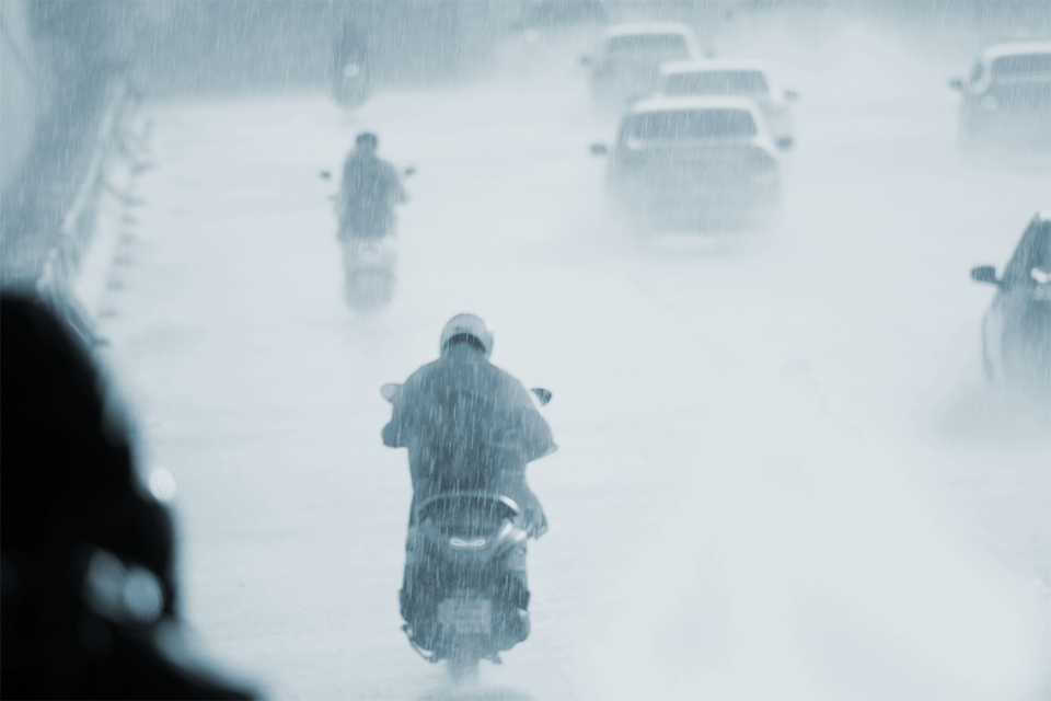Motorcyclist ride in deep fog