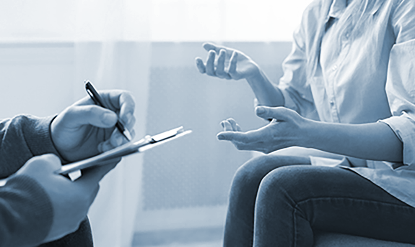 Therapist talks with client 