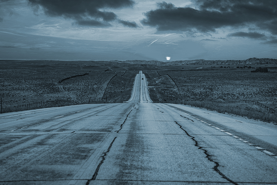 Long road into the sunset near Cody Wyoming.