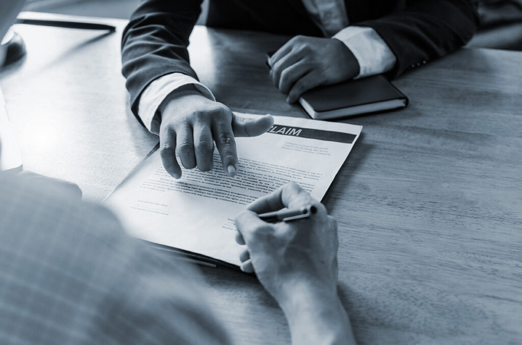 legal consultants, notary or justice lawyer discussing contract document and notebook on desk with client customer in courtroom office
